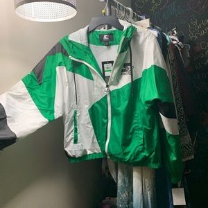 Green, white, and black windbreaker